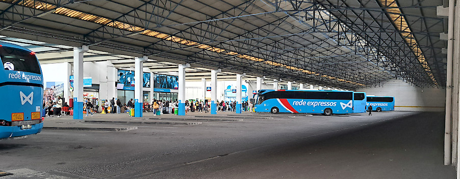 Sete Rios bus station with some buses and people